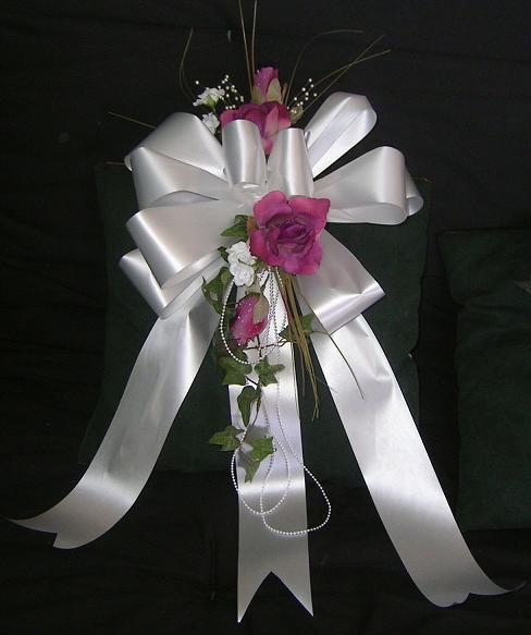 Wedding flowers pew bow